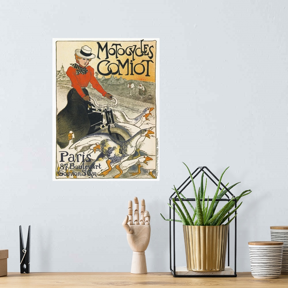 A bohemian room featuring Poster for Comiot motorcycles in Paris, France. Lithograph by Theophile Alexandre Steinlen, 1899.