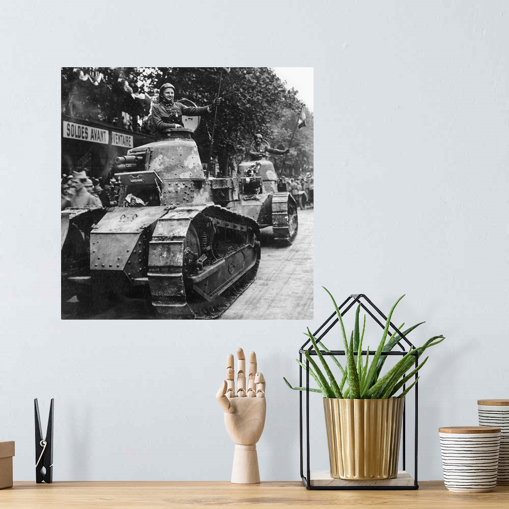 A bohemian room featuring French tank parading through the streets of Paris. From a stereograph, 1918.