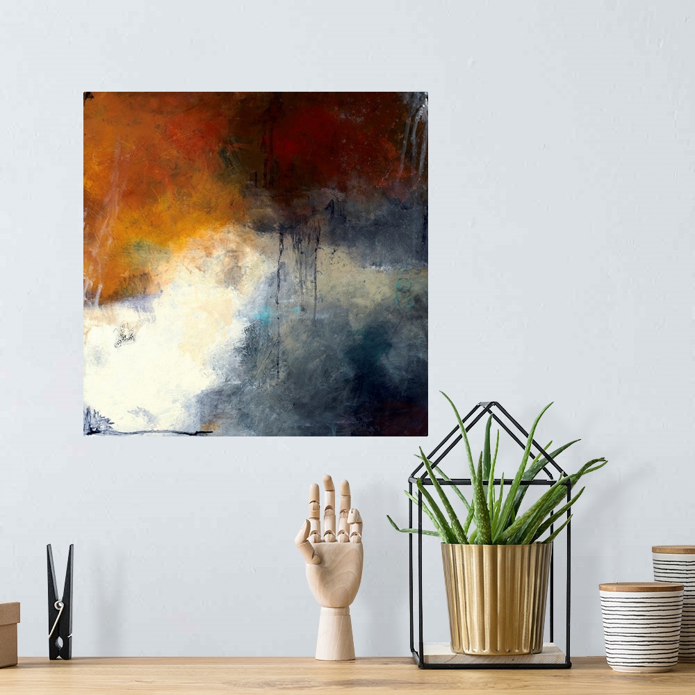 A bohemian room featuring Square abstract painting with splotches of deep red, orange, and blue hues and a pop of bright wh...