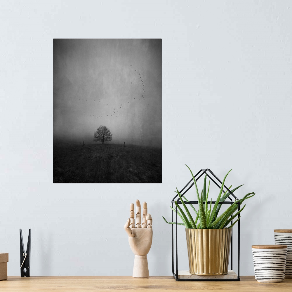 A bohemian room featuring Silhouettes of two persons walking away from each other and a lonely tree in a strange and furthe...