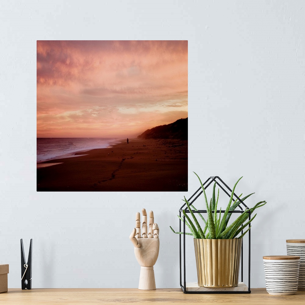 A bohemian room featuring The Australian coast at sunset with a figure in the distance