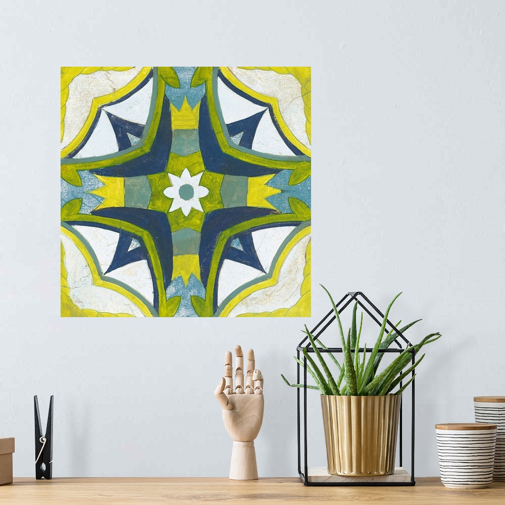A bohemian room featuring Decorative square painting of a floral tile design in colors of blue, green, yellow and white.