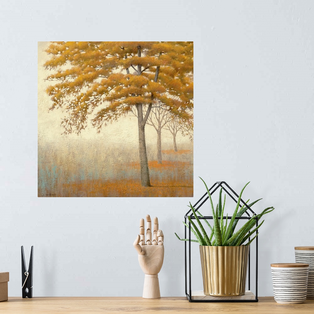 A bohemian room featuring Painting on canvas of a line of trees in a foggy landscape.
