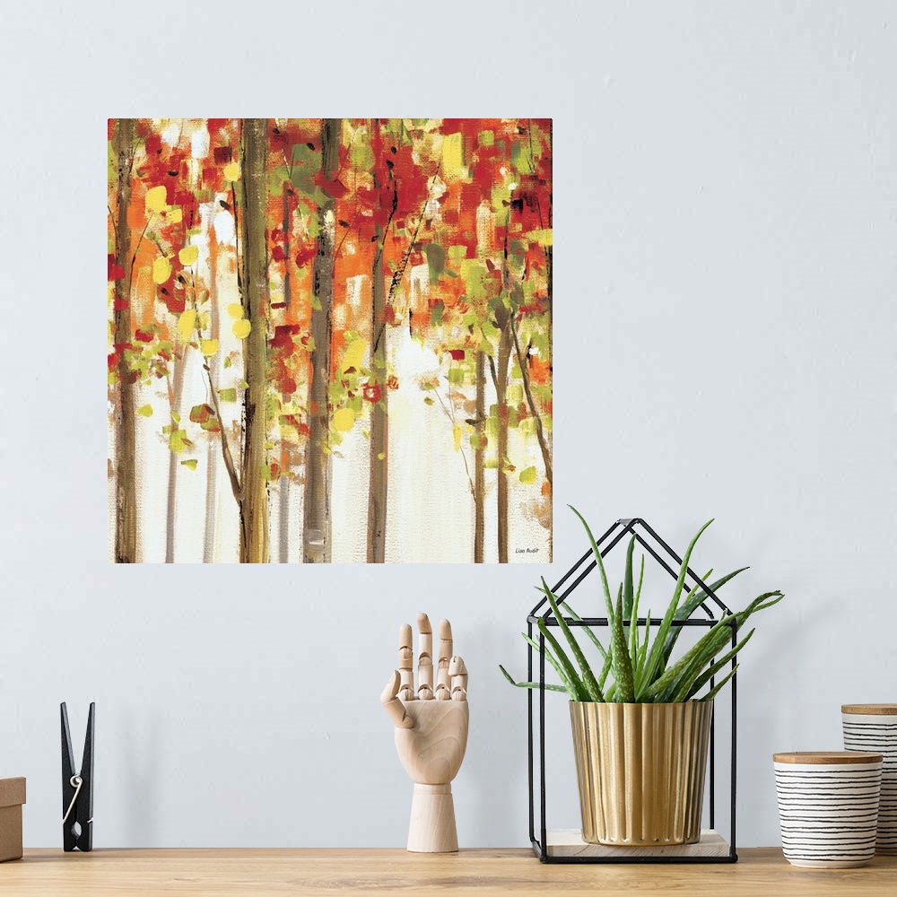 A bohemian room featuring Contemporary painting of tree tops covered in fall colored foliage.