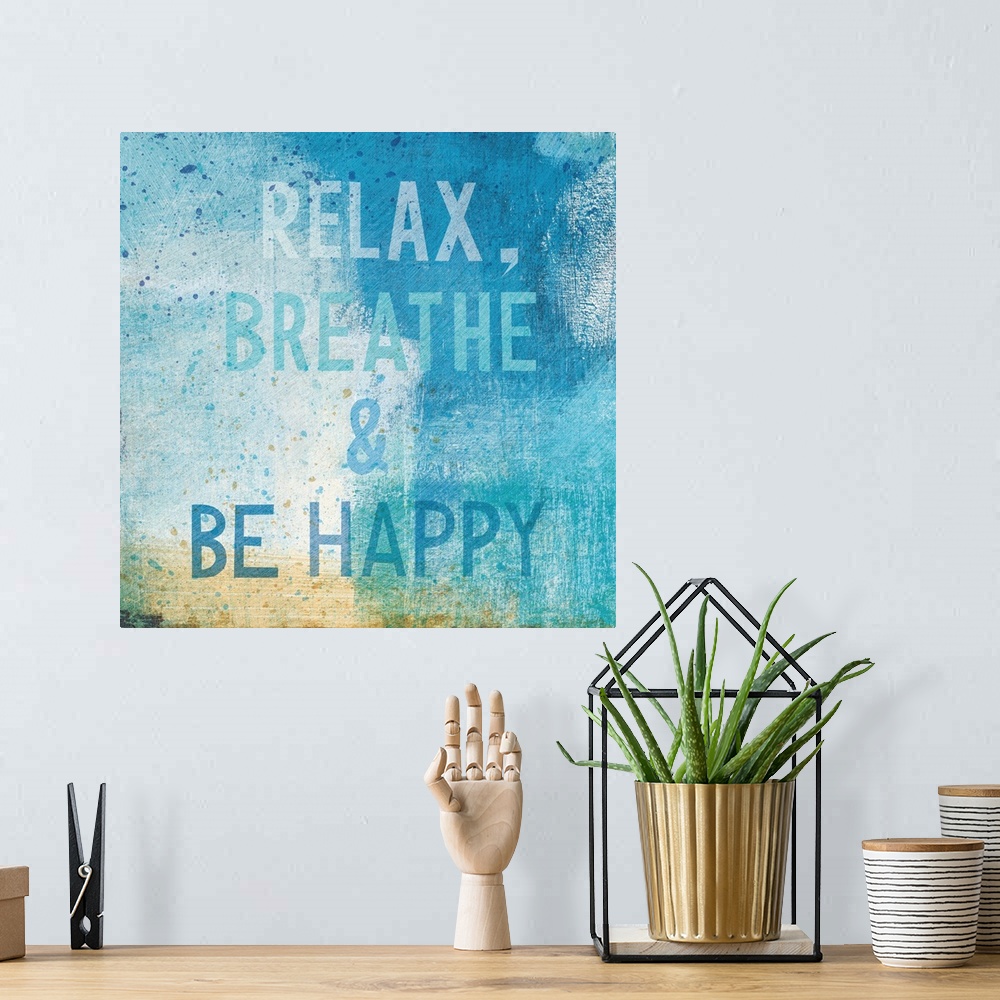 A bohemian room featuring "Relax, Breathe, and Be Happy"