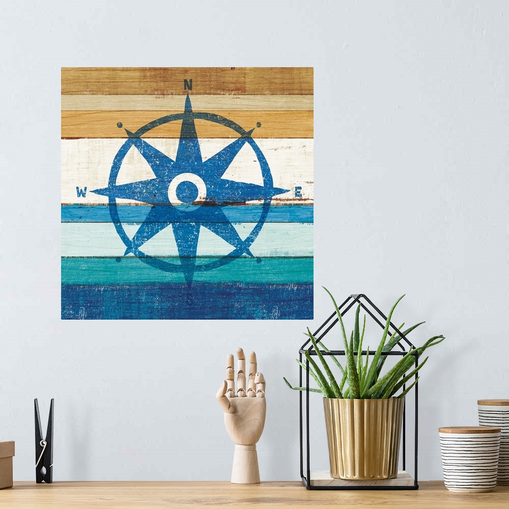 A bohemian room featuring Blue rose compass on a blue and brown painted wood background.