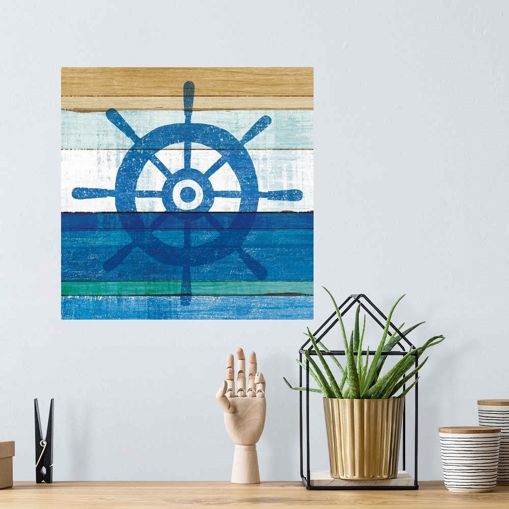 A bohemian room featuring Blue wheel on a blue and brown painted wood background.