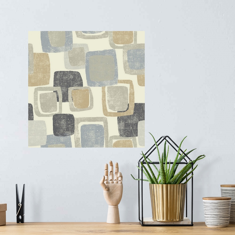 A bohemian room featuring Abstract artwork filled with gray, tan, and blue squares stacked on a cream colored background.