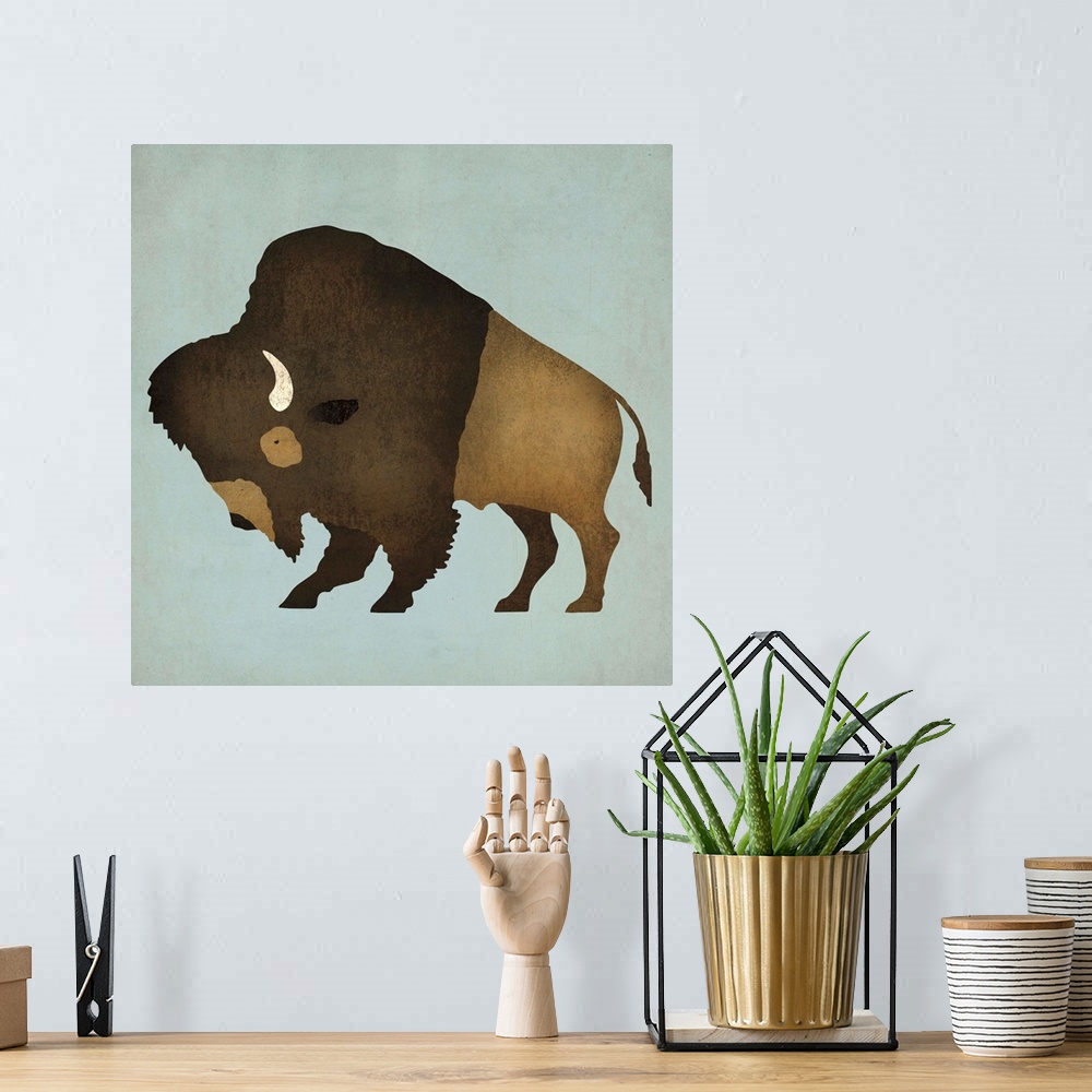 A bohemian room featuring Artwork of a furry buffalo with white horns on a pale blue background.