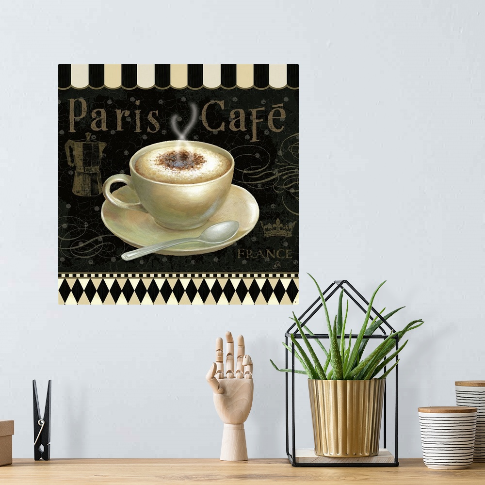 A bohemian room featuring Design featuring a steaming cup of mocha on a saucer with a spoon and a decorative black and whit...
