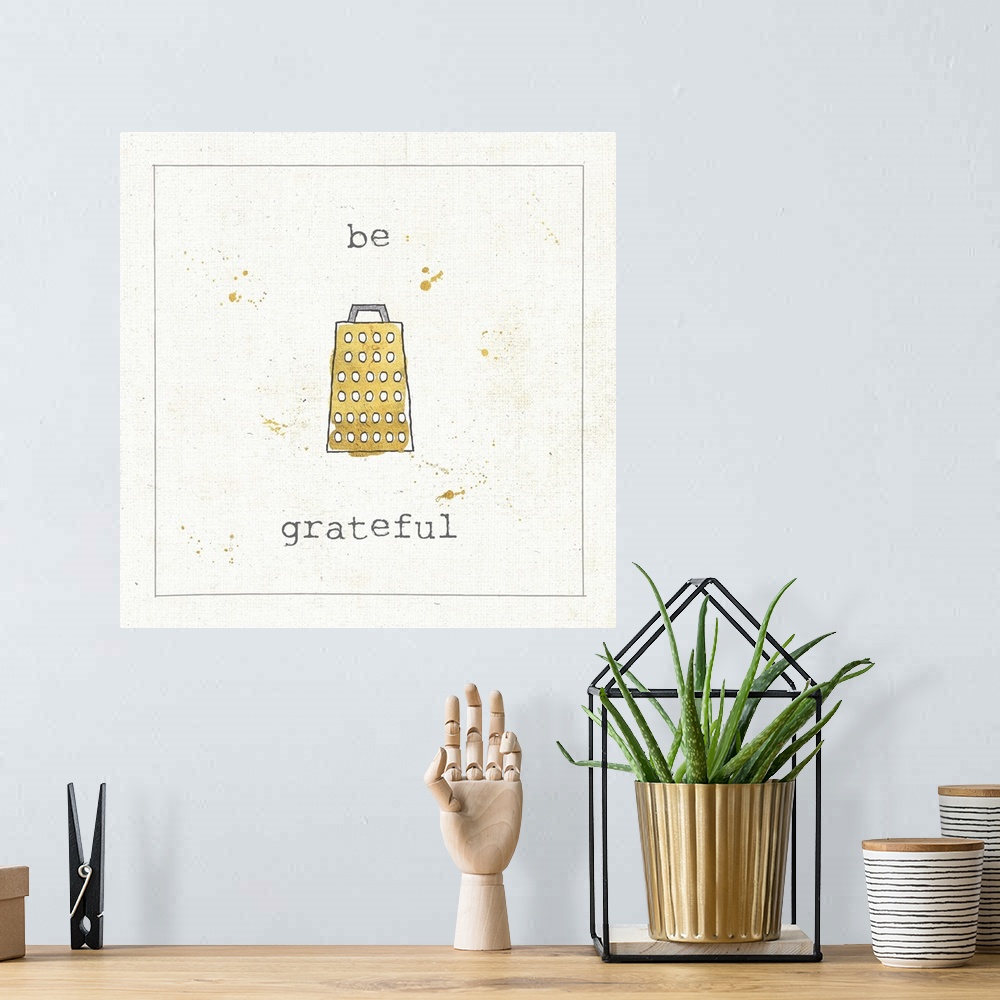 A bohemian room featuring "Be Grateful" pun in metallic gold and silver.