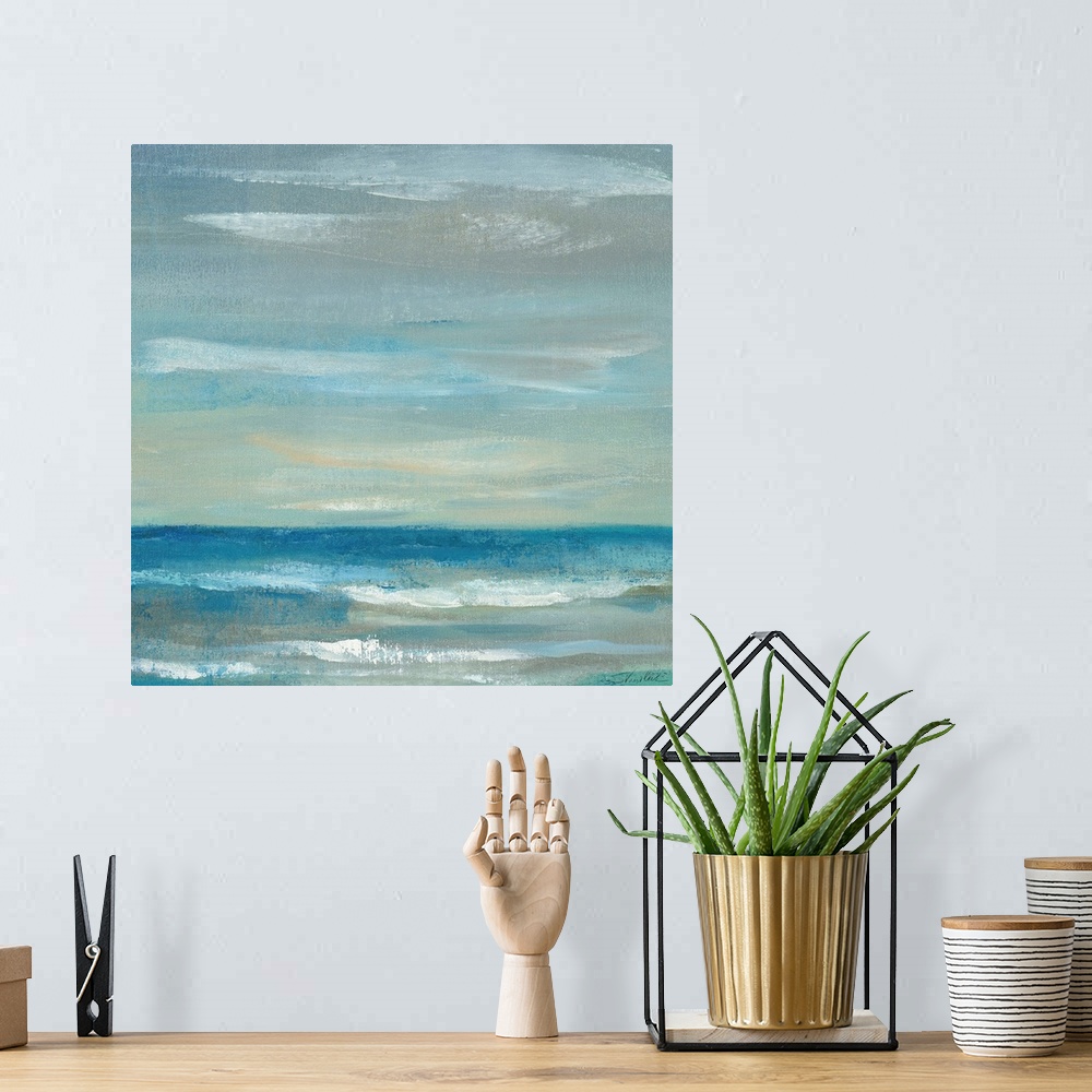 A bohemian room featuring Contemporary artwork of a calm ocean and sky.