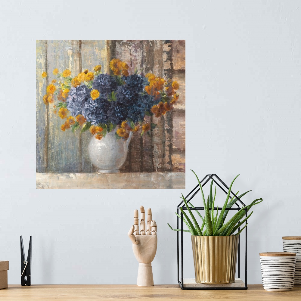 A bohemian room featuring A traditional contemporary painting of a white porcelain vase full of orange and blue flowers aga...