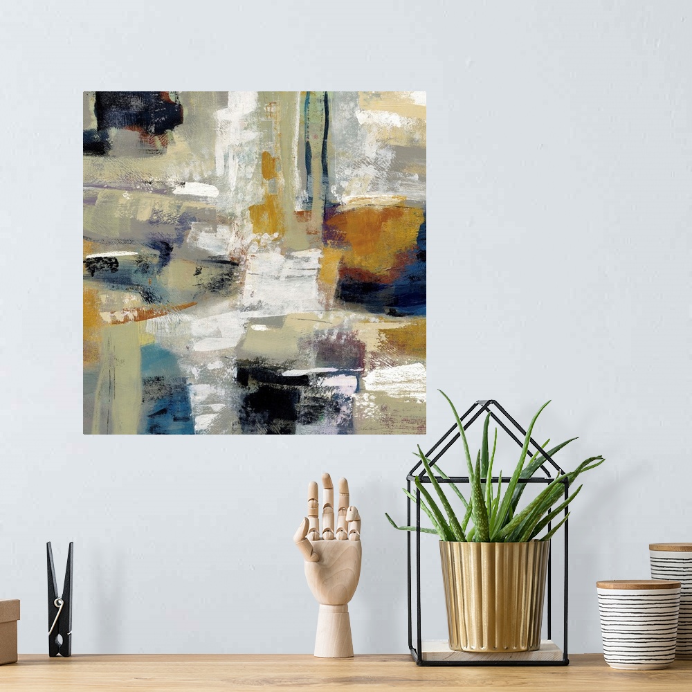 A bohemian room featuring Square abstract painting with bold colors and brushstrokes.