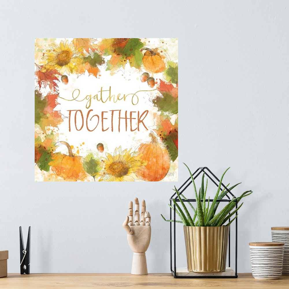 A bohemian room featuring "Gather Together" written inside a harvest wreath with Fall leaves, acorns, sunflowers, and pumpk...