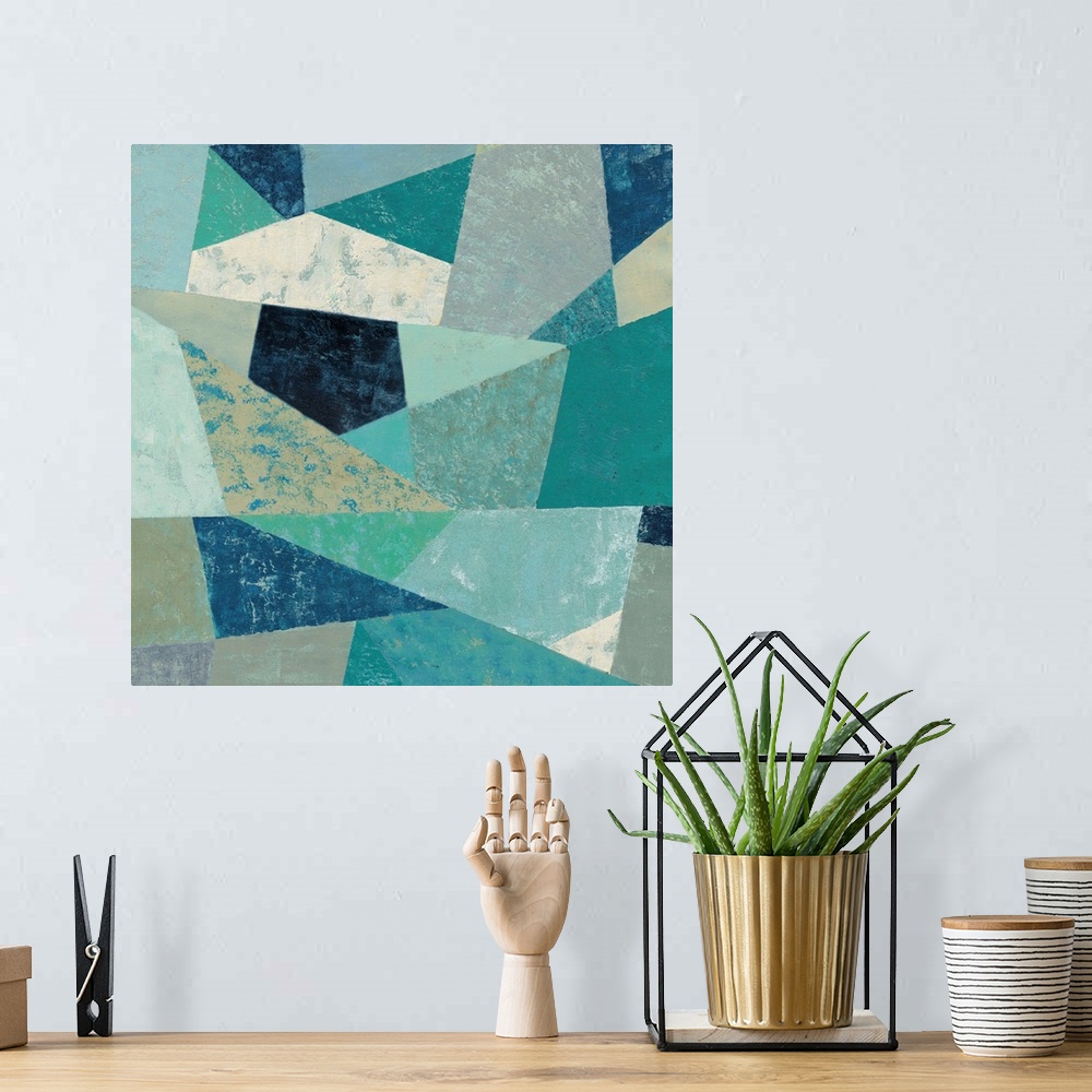 A bohemian room featuring Contemporary geometric artwork using cool green and blue colors with a retro mid-century vibe.