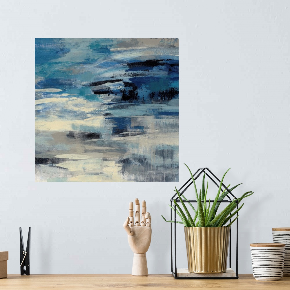 A bohemian room featuring Abstract artwork in stormy shades of blue.