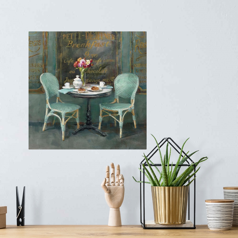A bohemian room featuring Contemporary artwork of two chairs and a table at an outdoor cafe.