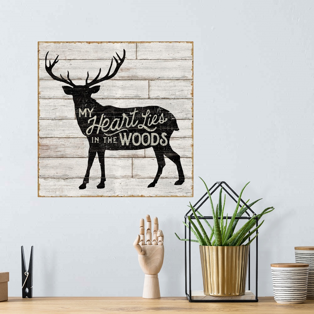A bohemian room featuring Contemporary rustic cabin decor artwork of a silhouetted nature element with a typographic sentim...