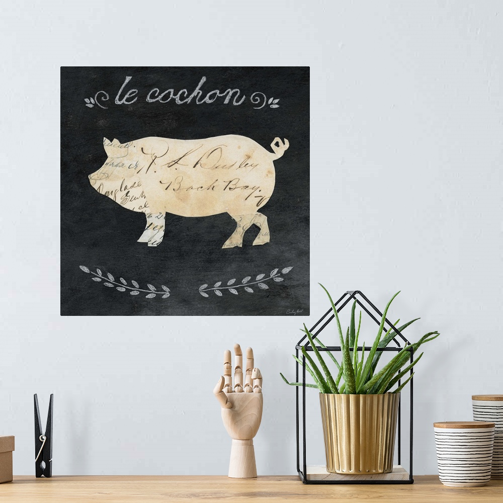 A bohemian room featuring Artwork of a pig cameo against a chalkboard background.