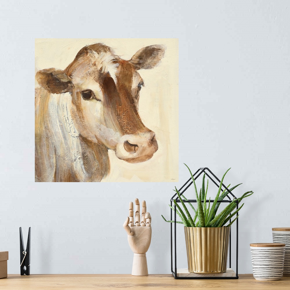 A bohemian room featuring Square contemporary painting of a cow in warm tones of color.