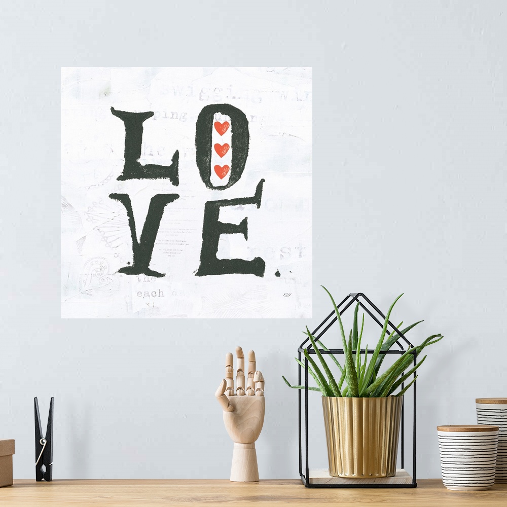 A bohemian room featuring Square painting with the word "love" written in two lines with red hearts on a white background w...