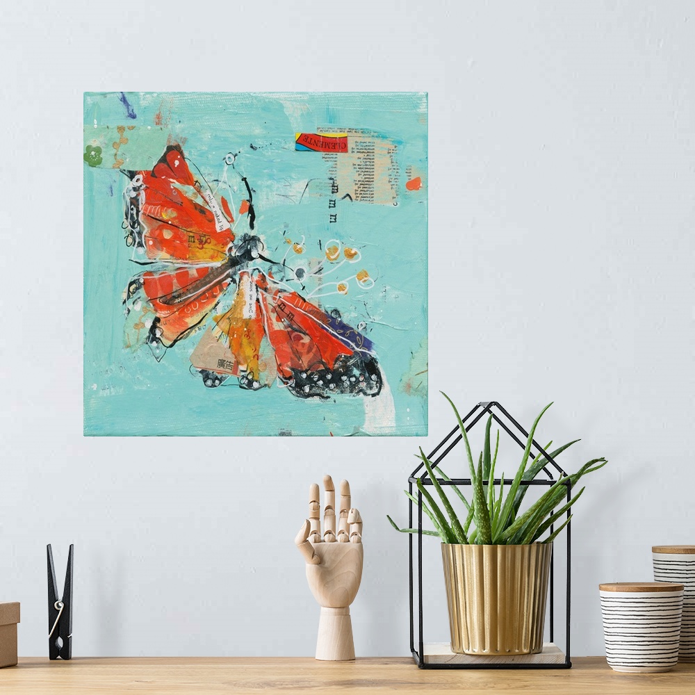 A bohemian room featuring Orange and red abstract monarch butterfly on a teal background made with mixed media.
