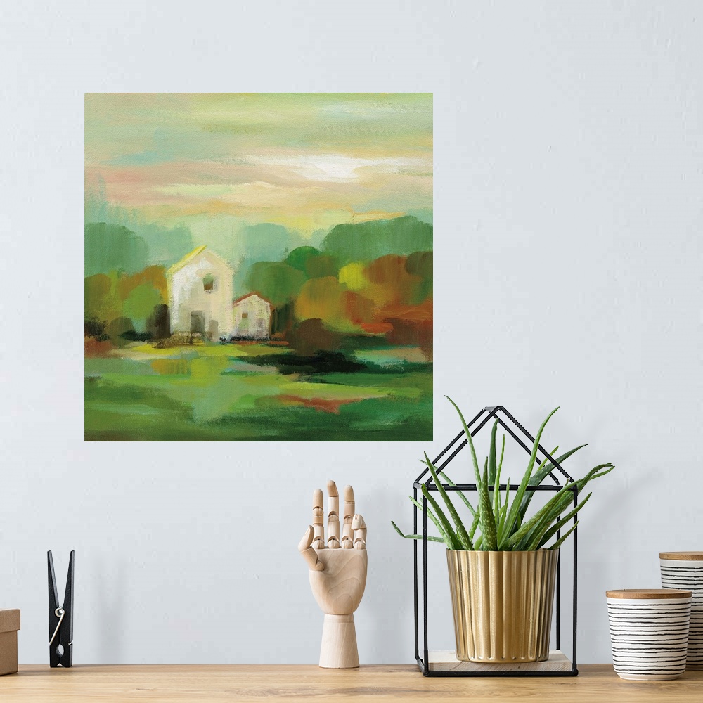 A bohemian room featuring A contemporary painting of a white house framed by fall trees.