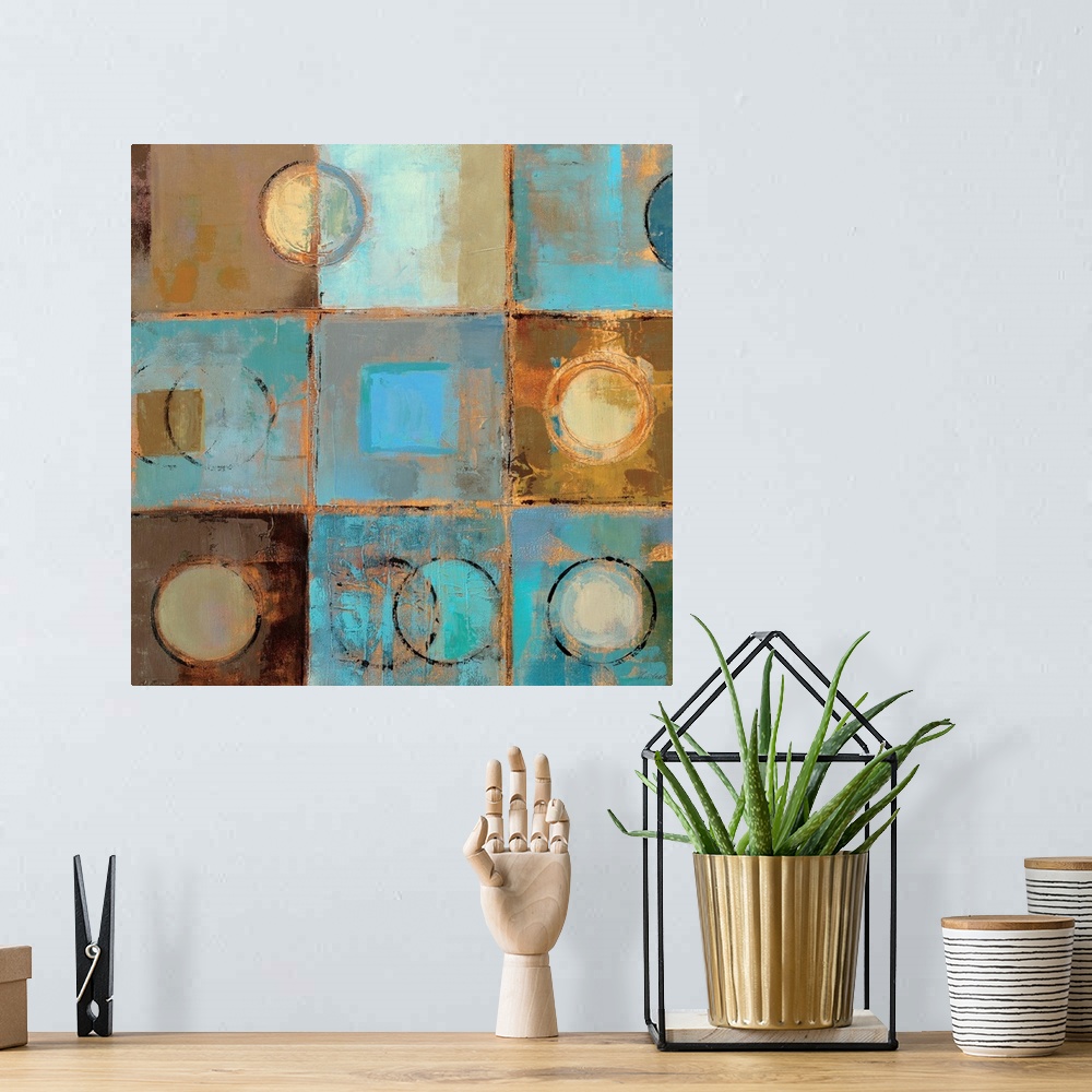 A bohemian room featuring Contemporary painting of squares and circles in cool aqua and earthy tones, separated by light ta...