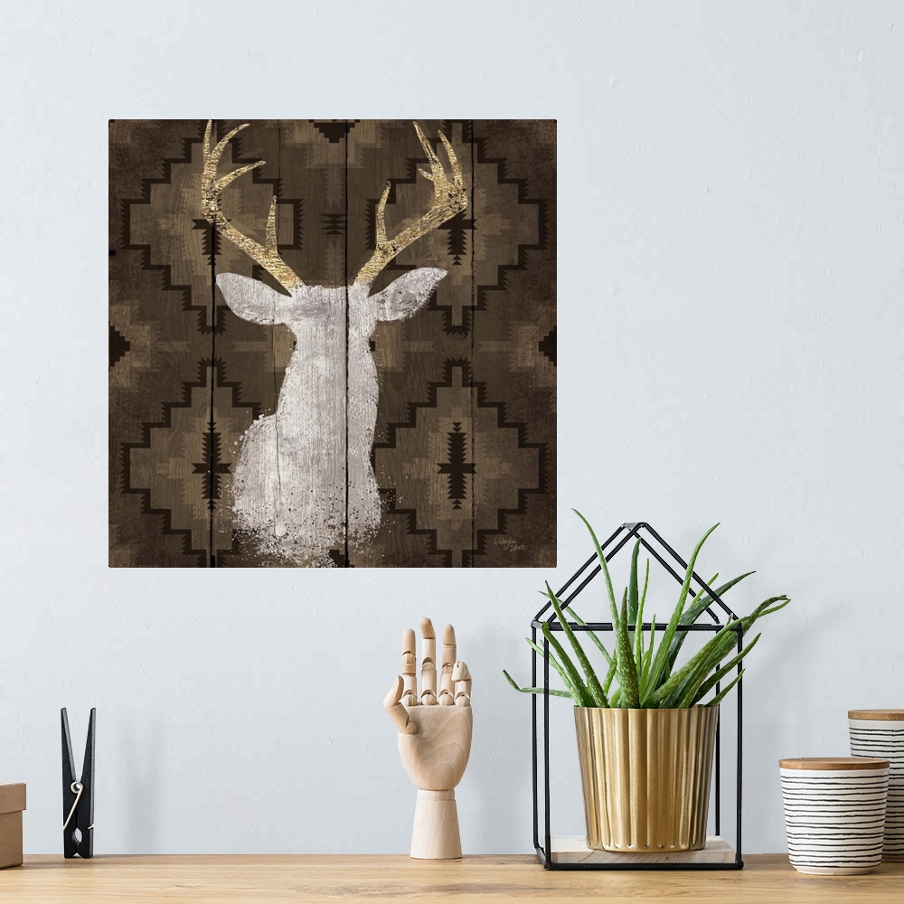 A bohemian room featuring Stag head silhouette against a rustic looking native american pattern perfect for a lodge in the ...