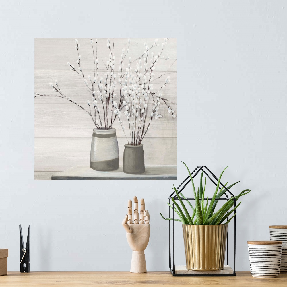 A bohemian room featuring Contemporary artwork of a serene still life scene of pussy willows in gray vases.