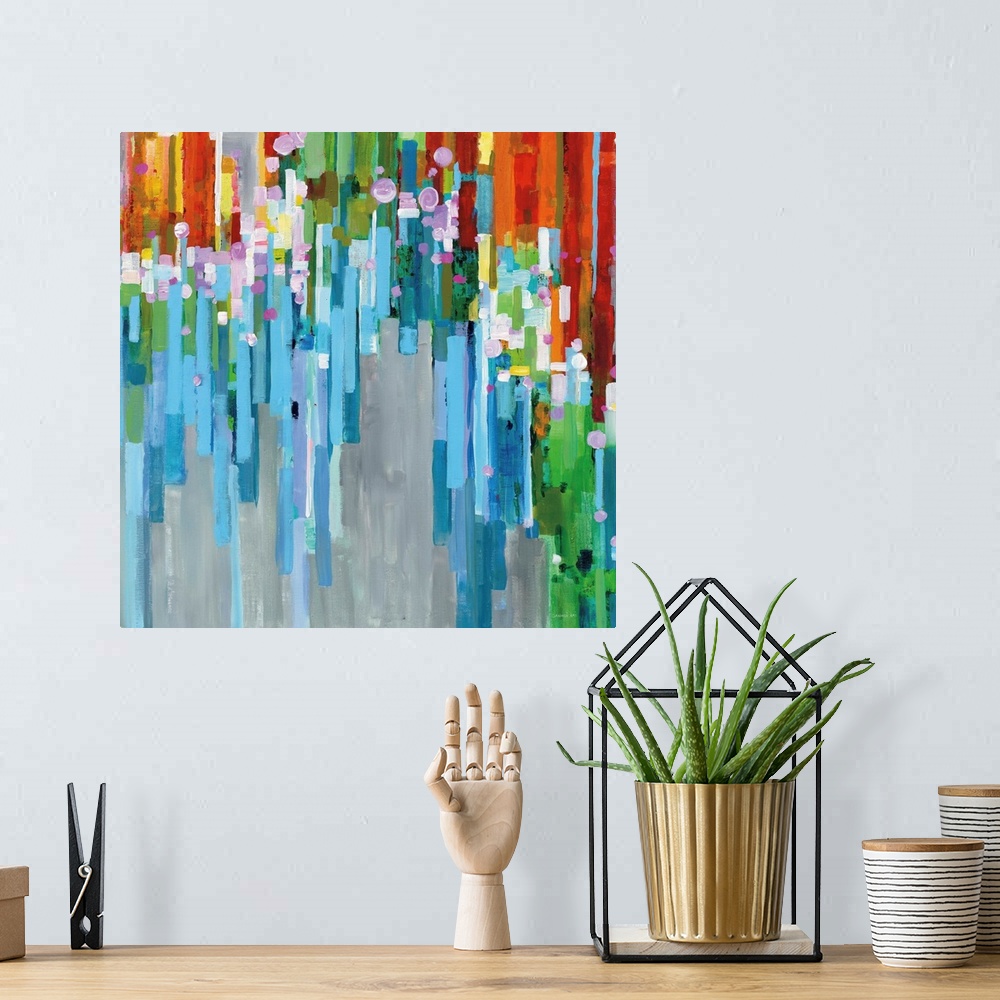 A bohemian room featuring Square abstract painting with rainbow vertical rectangles stacked together and falling from the d...