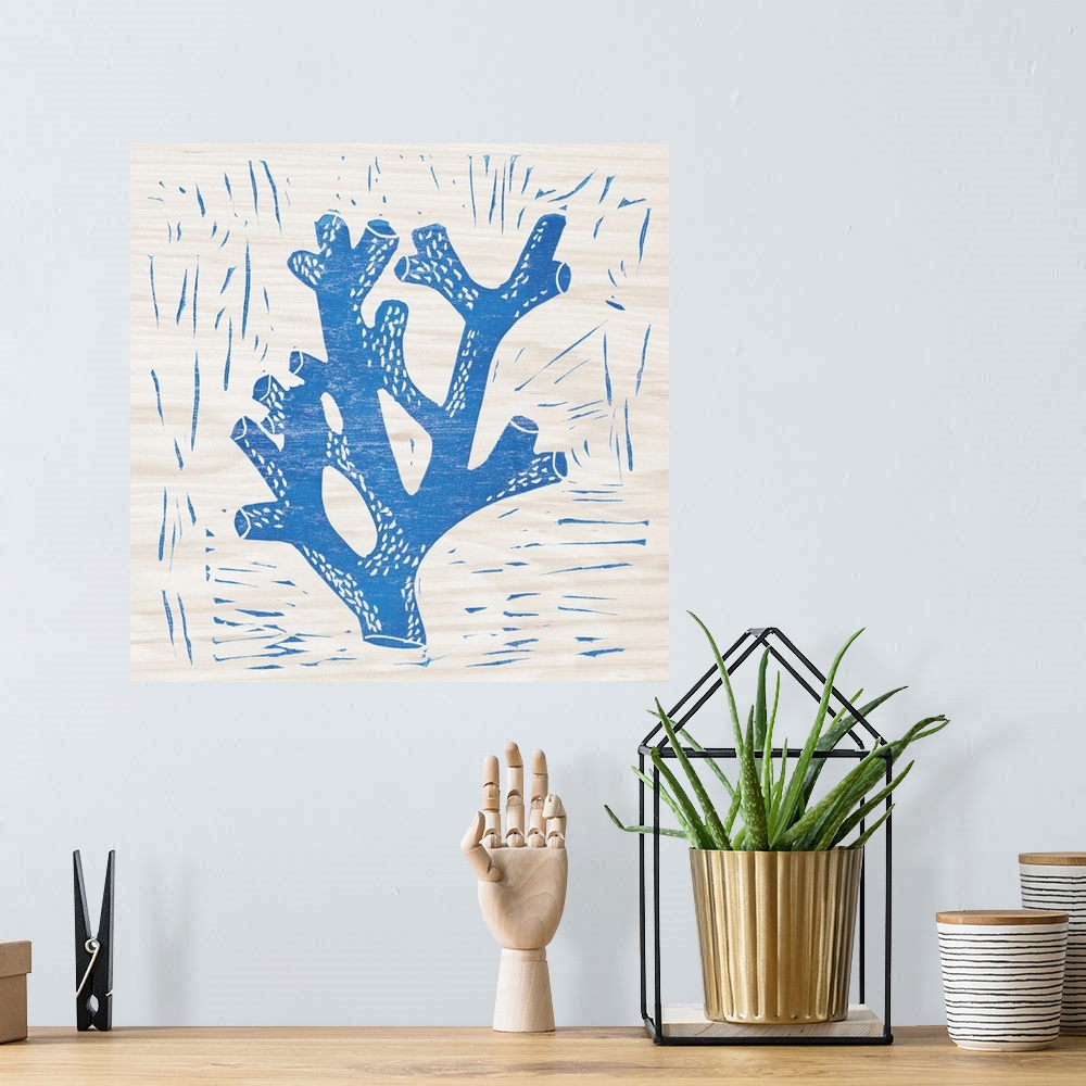 A bohemian room featuring Blue woodcut-style coral print on wood.