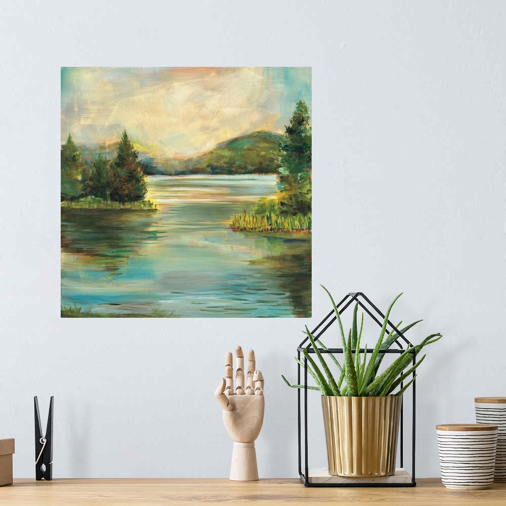 A bohemian room featuring Contemporary landscape painting of a lake at sunset with rolling hills in the distance.