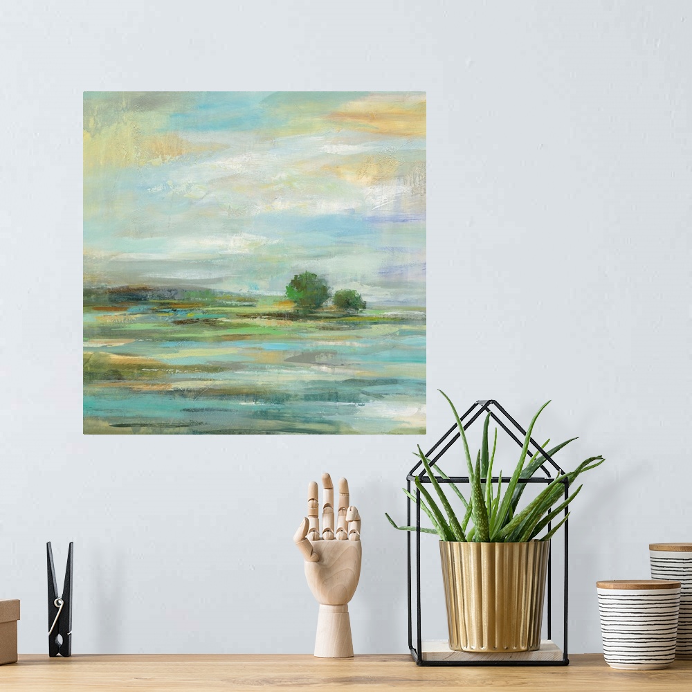 A bohemian room featuring Contemporary painting of a countryside landscape.