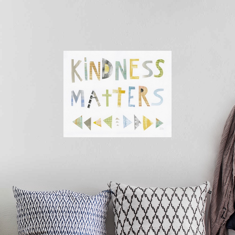 A bohemian room featuring Whimsy sentiment decor with the phrase "Kindness Matters" written in different colors.