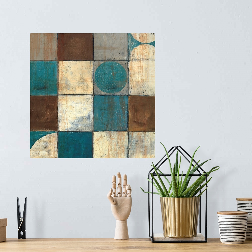 A bohemian room featuring Abstract painting of geometric shapes, with a couple of organic shapes all in warm and cool colors.