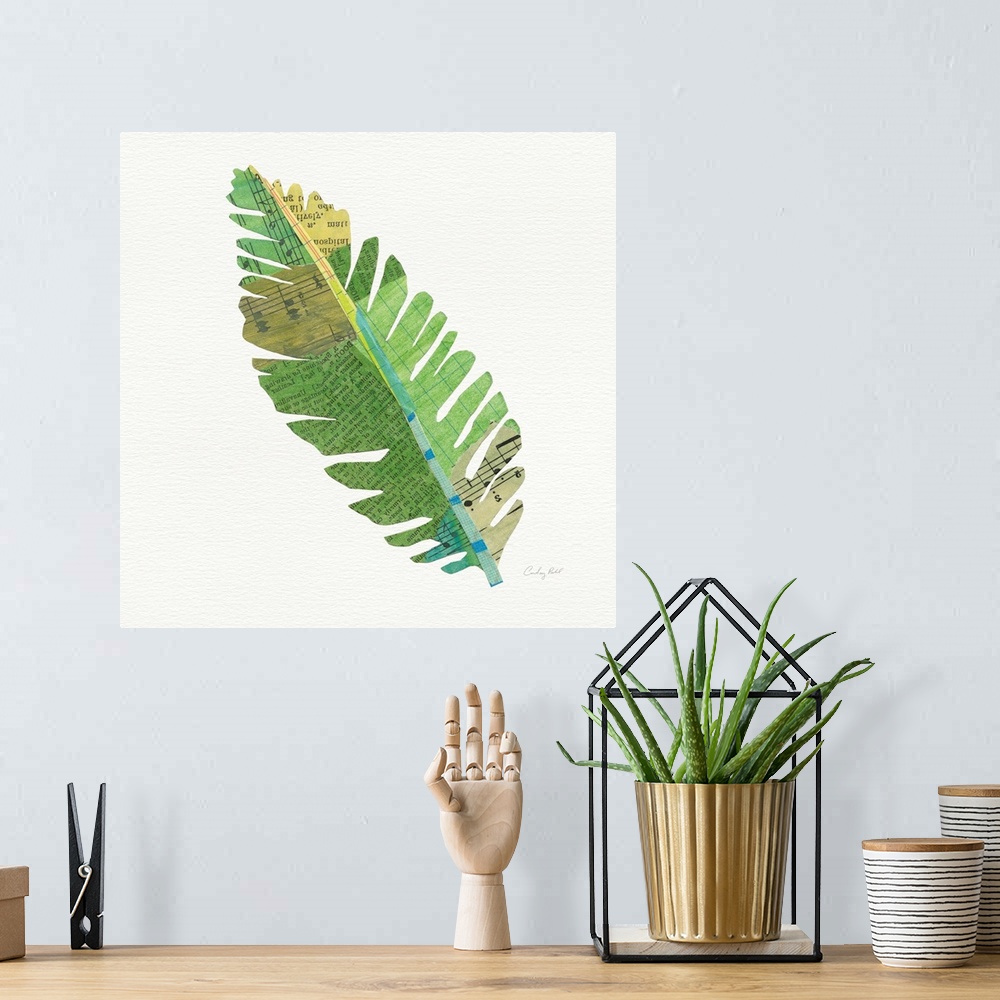 A bohemian room featuring Square decor with a green, blue, and yellow toned palm leaf made out with mixed media.