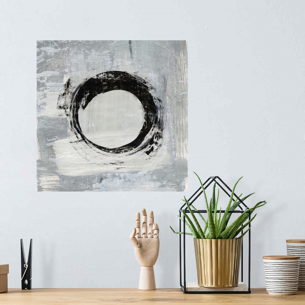 A bohemian room featuring Square abstract painting of a bold, black circle on a gray and white background.