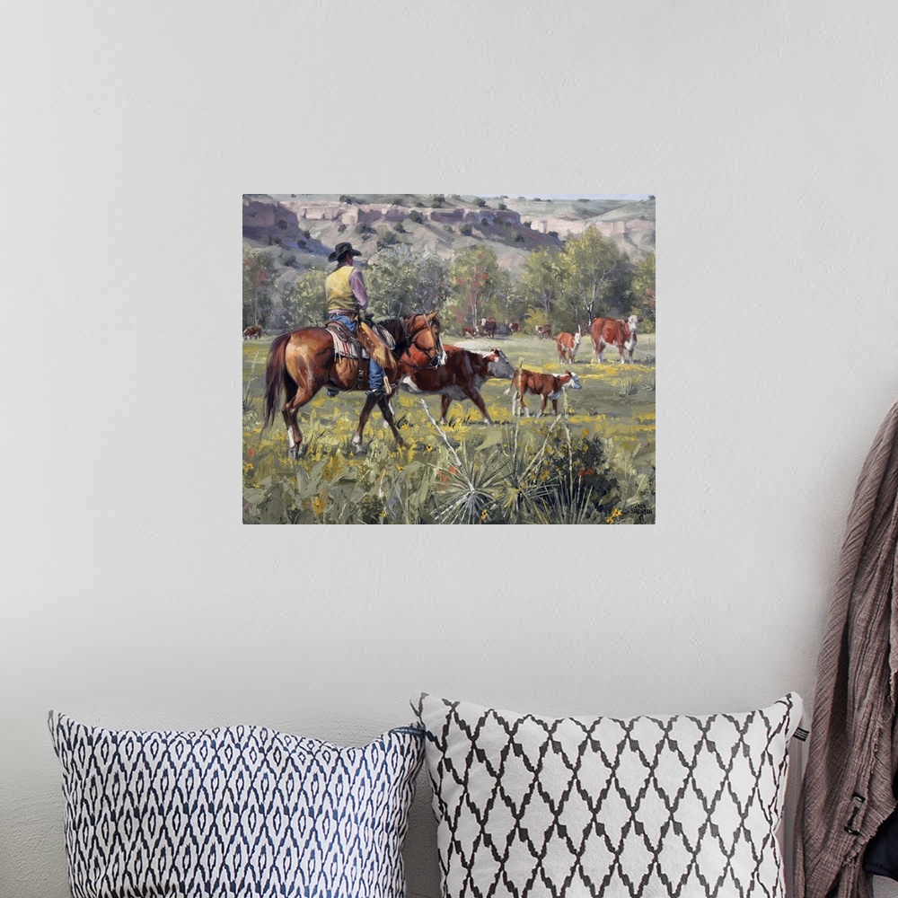 A bohemian room featuring This contemporary artwork of a cowboy and his cattle reminds one of the simple times during yeste...