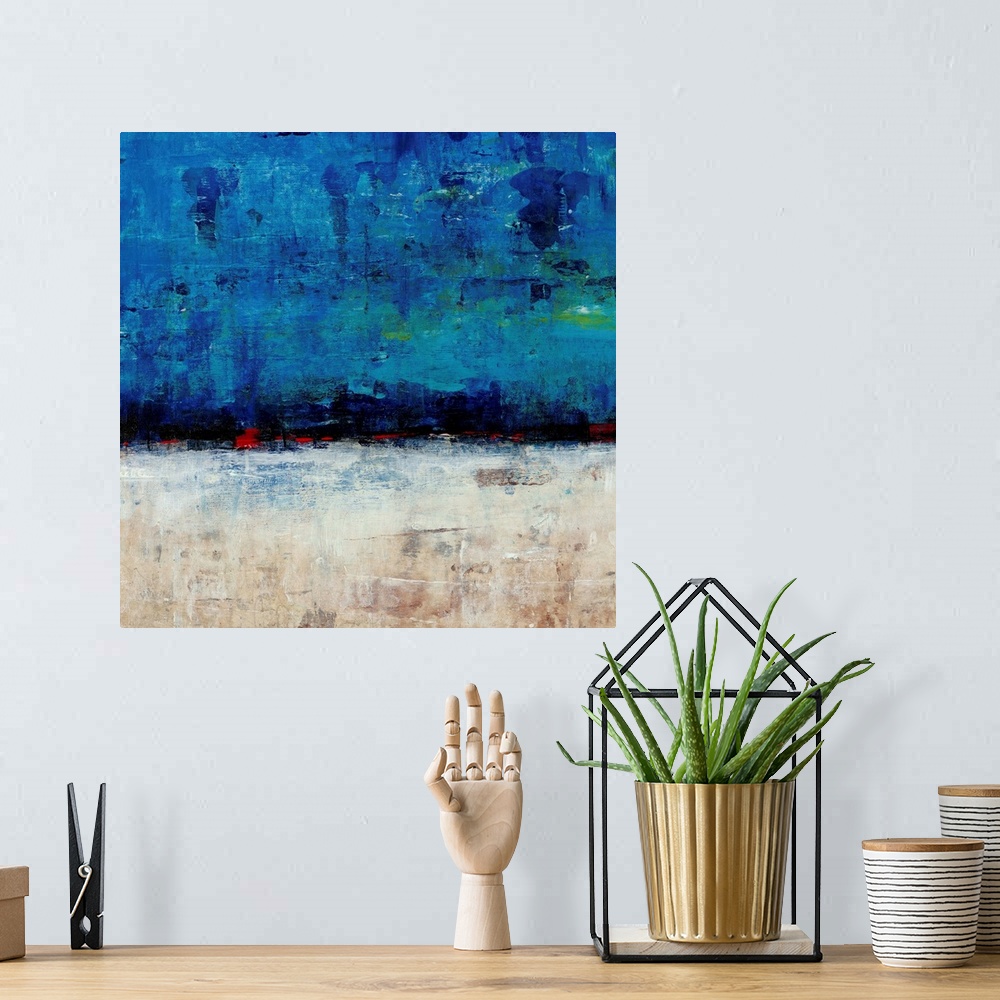 A bohemian room featuring Contemporary abstract painting resembling a white landscape under a deep blue sky.