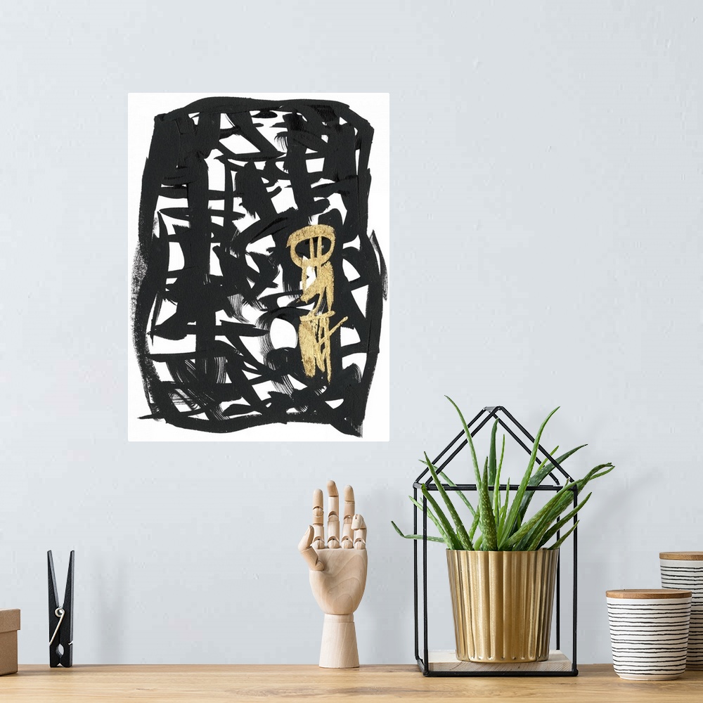 A bohemian room featuring Broad brush strokes in black and gold create letter-like abstract characters surrounded by a bord...