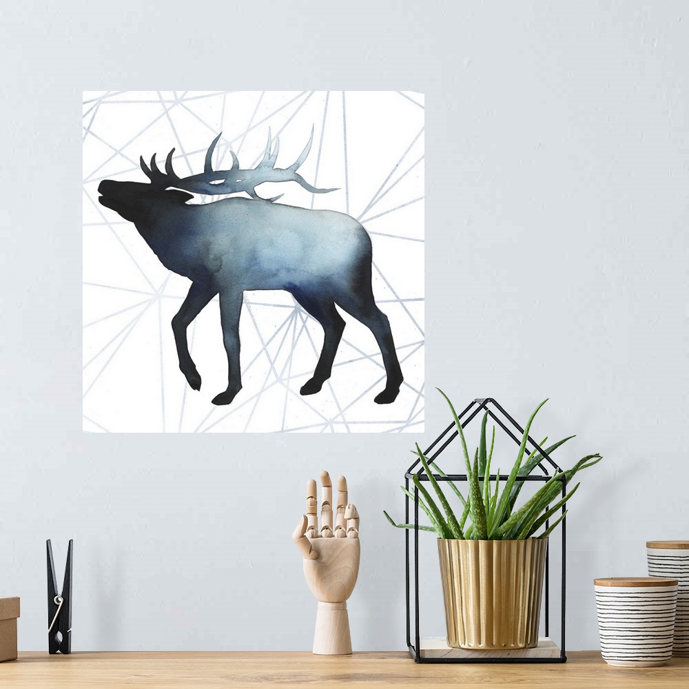 A bohemian room featuring Watercolor elk silhouette on a grey geometric background.