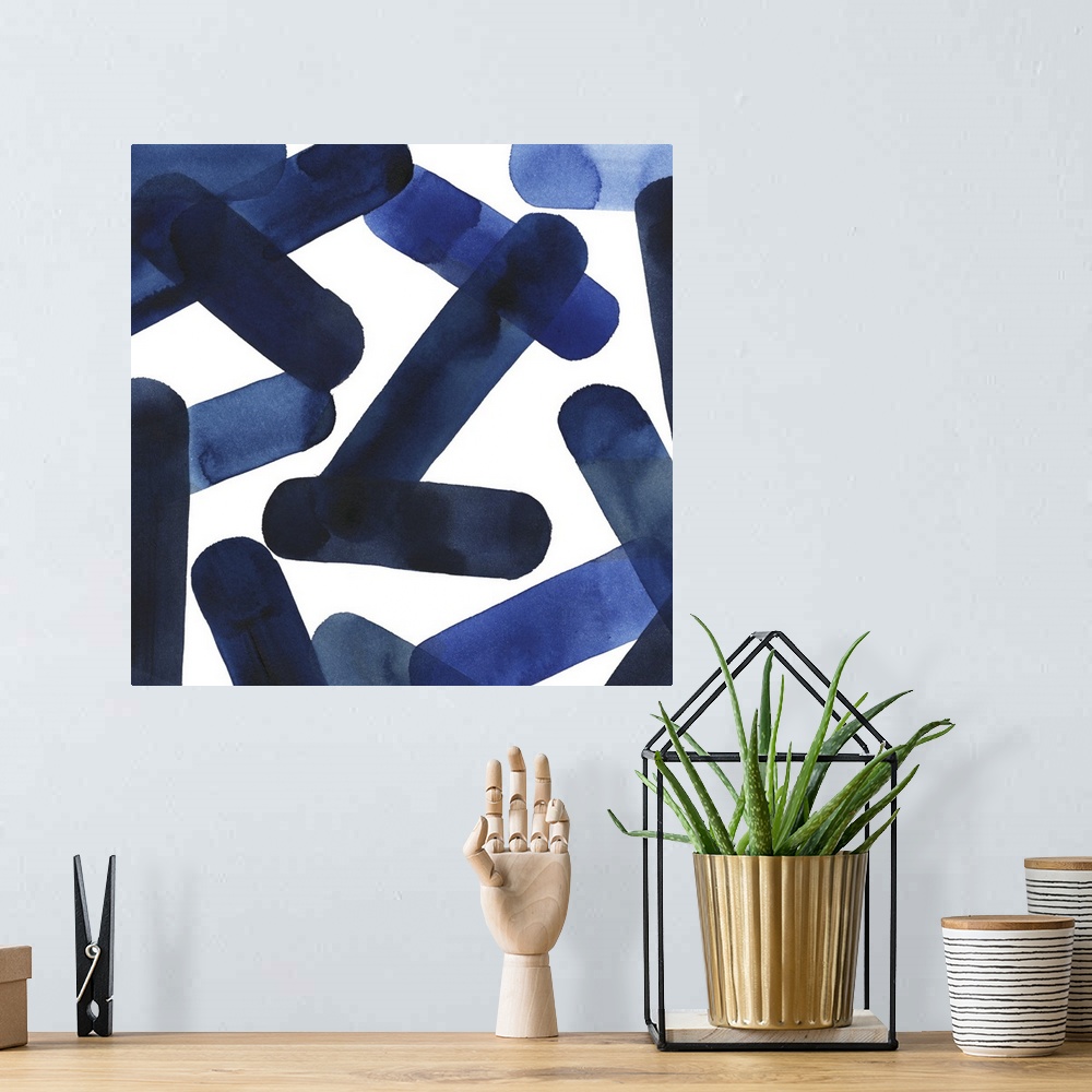 A bohemian room featuring Square abstract of blue elongated shapes falling over a white background.