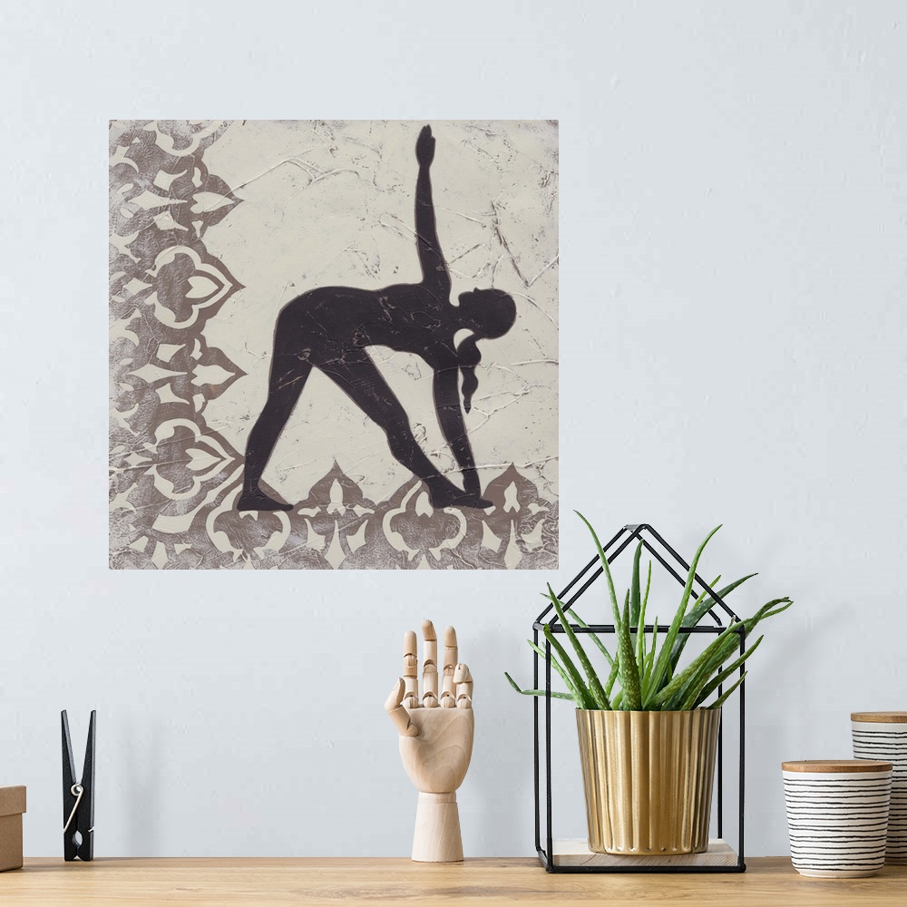 A bohemian room featuring Decorative print of a yoga pose.