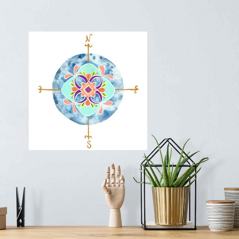 A bohemian room featuring Decorative compass with a leaf mandala-like pattern over a circular watercolor blue background.