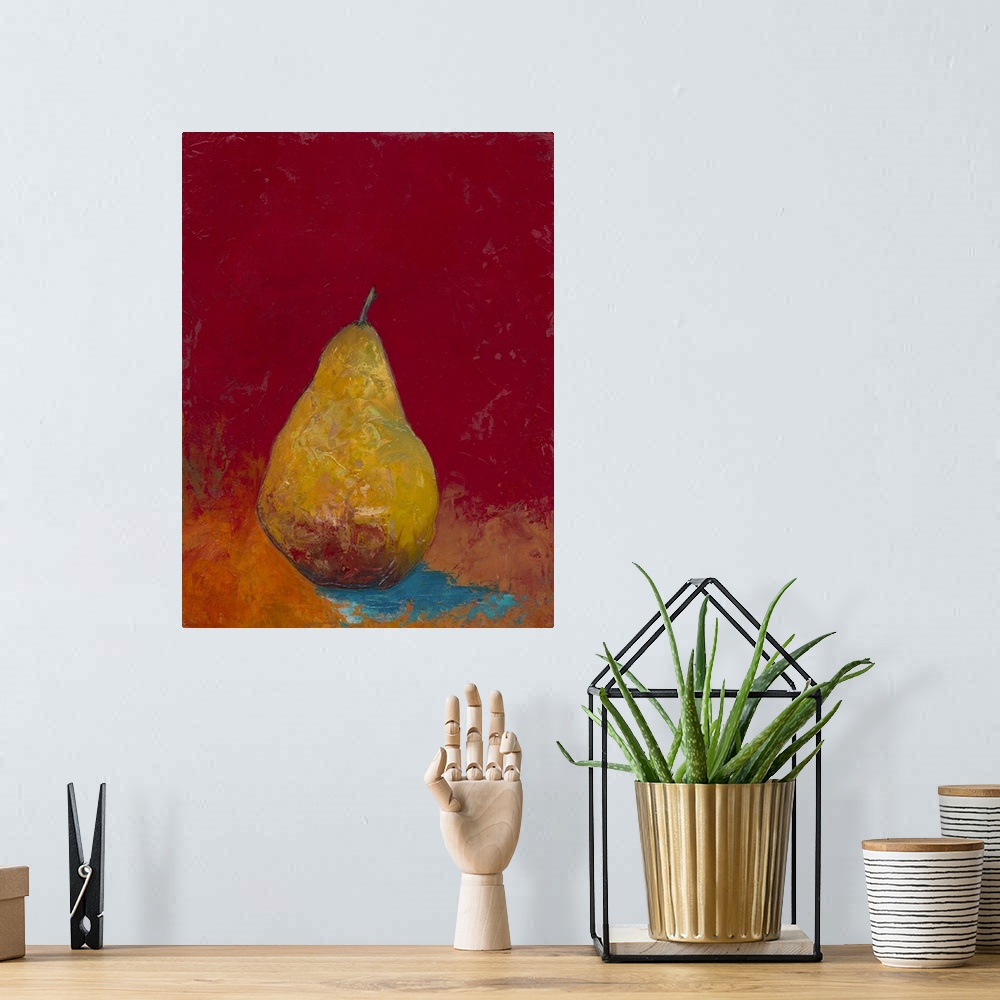 A bohemian room featuring Contemporary painting of a pear against a green background.