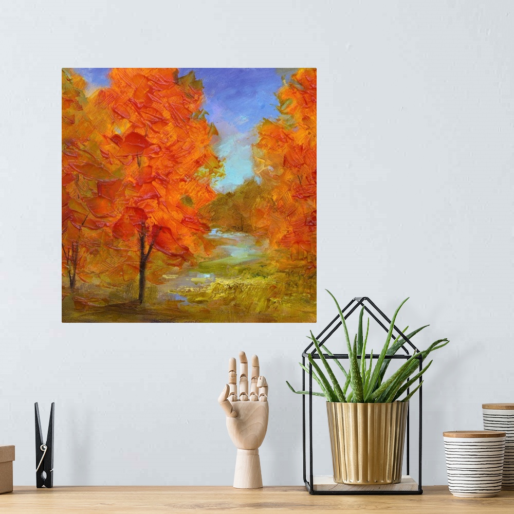 A bohemian room featuring Contemporary artwork of a grove of trees with bright orange leaves.