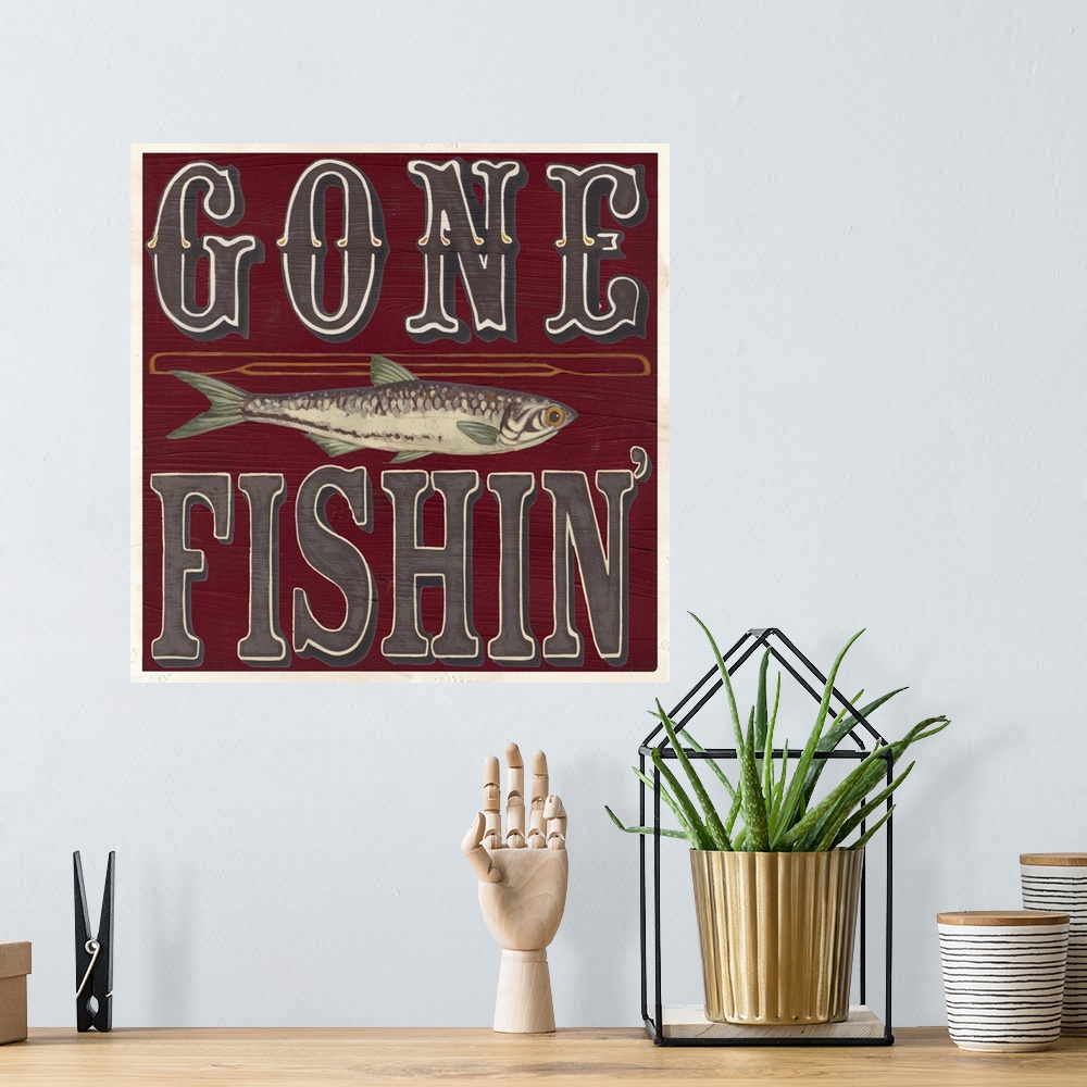 A bohemian room featuring Decorative sign for a cabin or lodge that reads "Gone Fishin'."