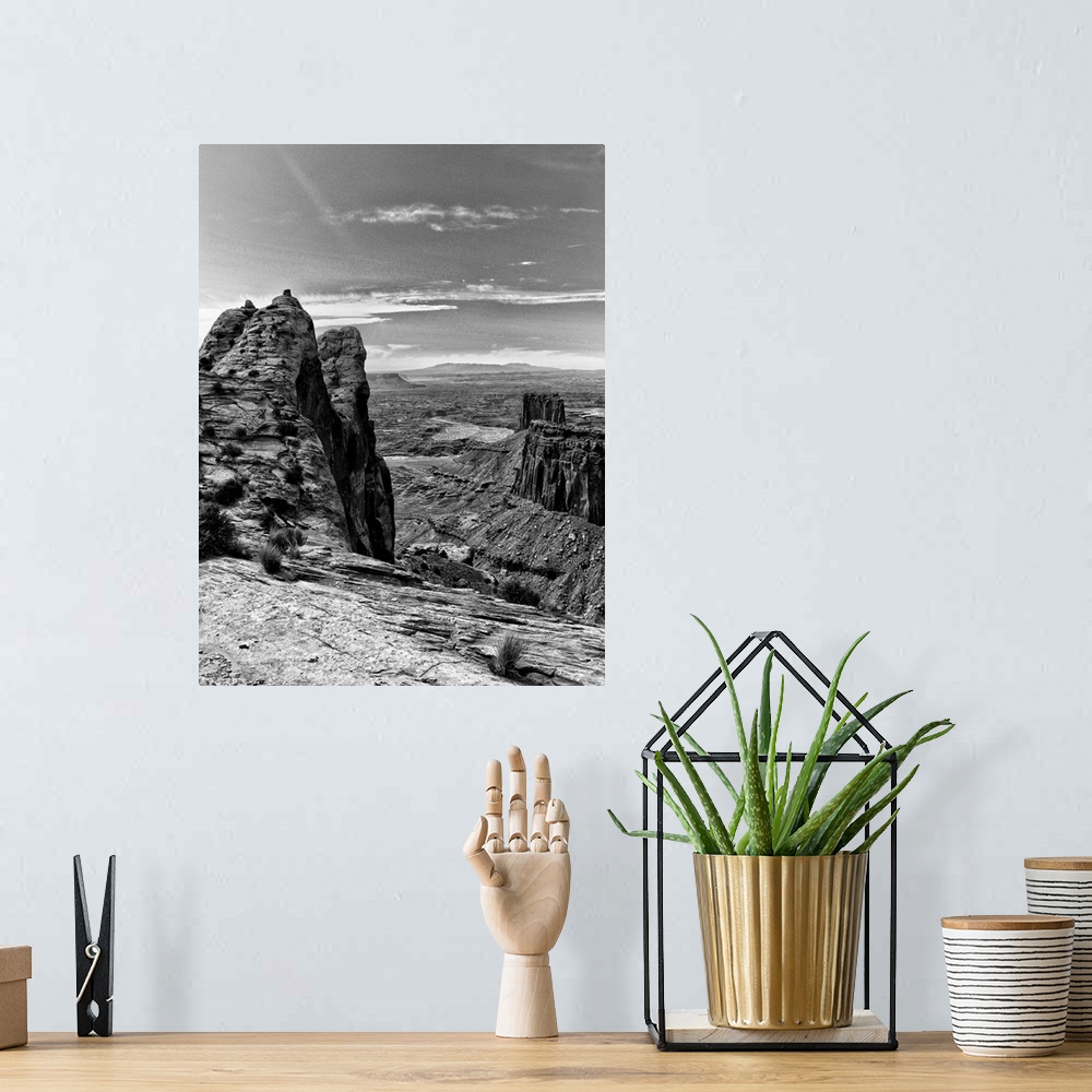 A bohemian room featuring Black and white photograph of Canyonlands National Park.